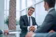 © ASDF - smiling businessman shaking hands with his business partner