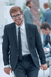 © ASDF - smiling business man standing in the office