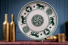 Decorative, Painted Plate On A Gray Background.