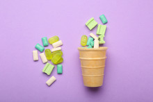 Wafer Cone With Different Chewing Gums On Color Background