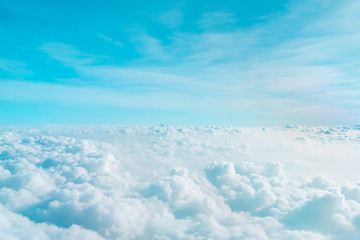 Wall Mural - airplane window view above beautiful white cloud summer blue sky and sun light abstract nature.