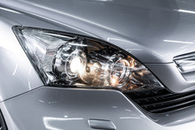 Silver Car Headlights. Exterior Detail. Close Up Detail On One Of The LED Headlights Modern Car..