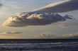 Unusual cloud formation in evening sky over California ocean.