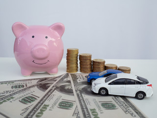 piggy bank on pile of dollar, graph and calculator. coins stack. stethoscope.