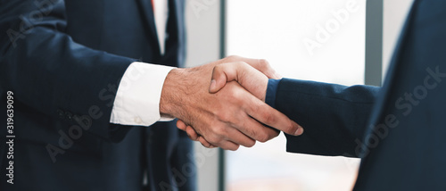 Fotomural business background of businessman having handshaking after finish business deal