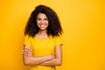 Poster - Close-up portrait of nice attractive lovely pretty charming intellectual cheerful cheery wavy-haired girl nerd folded arms isolated on bright vivid shine vibrant yellow color background