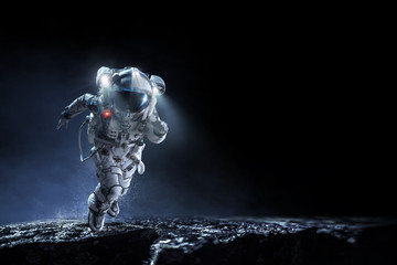 Wall Mural - Spaceman running fast. Mixed media