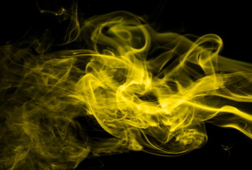 Yellow smoke on black background