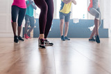 Cropped view of multicultural dancers exercising movements of zumba in dance studio