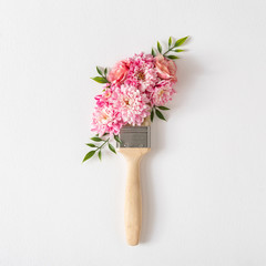 Poster - Flowers composition. Creative layout made of pink and white flowers and paint brush on white background. Flat lay, top view.