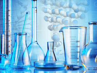 Wall Mural - microscope with lab glassware, science laboratory research and development concept