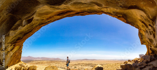 Panoramic view from a cave at Blutkuppe over the desert of Namib Naukluft Par...