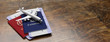 © Rawf8 - Plane tickets and passports on wood, banner, copy space. 3d illustration