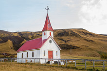 Red And White Church In The Middle Of A Field