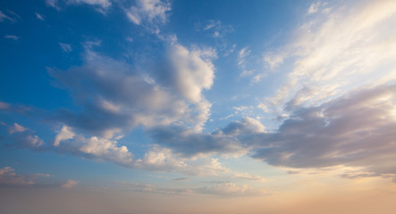 Wall Mural - blue sky clouds background. beautiful landscape with clouds and orange sun on sky
