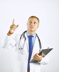 Wall Mural - Young confident doctor in a white coat with a stethoscope