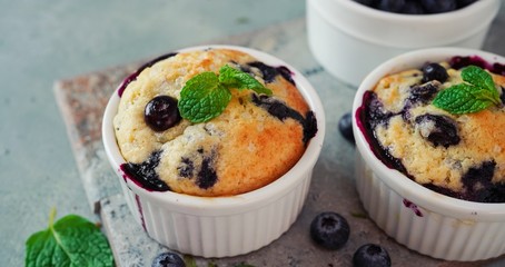 Wall Mural - Homemade Blueberry Muffin for one baked in a ramekin, selective focus