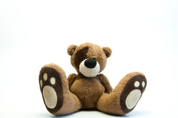 Children's soft toy brown bear. On white background