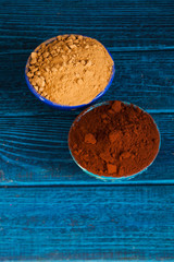 Canvas Print - Natural cocoa substitute. Healthy eating concept. Organic carob and cacao powder in bowls.