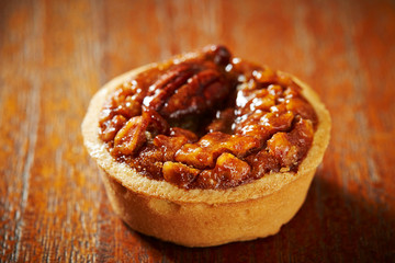 Sticker - Pecan nuts tart on wooden background 