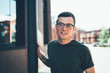 © BullRun - Young guy in casual outfit hiking at city street