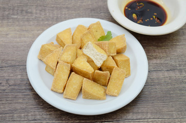 Eating of fried tofu diced with soy sauce