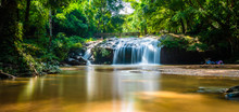 Beautiful Waterfall Mae Sa, Thailand. Fresh And Pure Water Stream Is Flowing On The Rock Stone Ground In Tropical Rainforest. Fresh Plants And Trees Above River. Vibrant Colors In Pure Nature