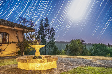 Wall Mural - an amazing star trail nightscape with the milky way and its galactic core in sagittarius below the s