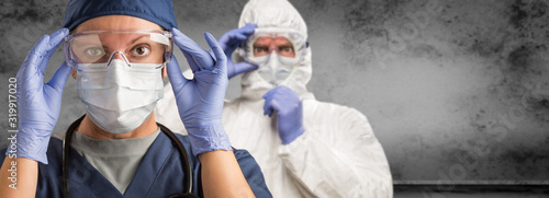 Fotografía Female and Male Doctors or Nurses Wearing Scrubs and Protective Mask and Goggles