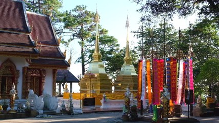 Sticker - 17 November 2019,  Wat Phra That Doi Tung, Chiang Rai, Thailand. The famous golden pagoda temple decorate with Tung (Northern Thai Flag) (Thai Translate:  Worship words to the Pagodas)