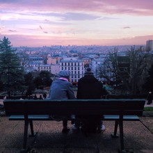 Couple Sitting On Bench AGAINST SKY AT SUNSET