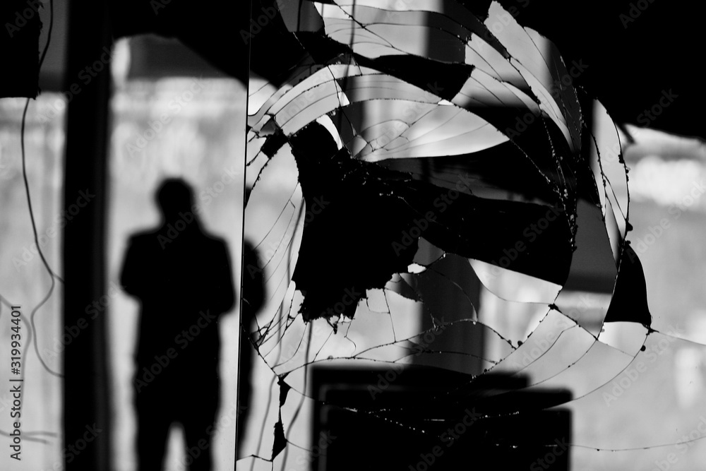 Reflection Of Silhouette Man On Broken Mirror - obrazy, fototapety, plakaty 
