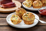 Fototapeta Dinusie - Savory muffins with bacon, green onion and cheese.