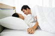 © DG PhotoStock - Romantic moment of young Asian couple. A couple making love together on the bed in morning. Valentine concept.