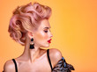 © Valua Vitaly - Beautiful woman with creative hairstyle, vivid makeup. Fashionable girl. Beautiful face of young woman with red lips. Stunning blonde girl. Bright eye makeup. Attractive caucasian model with earrings