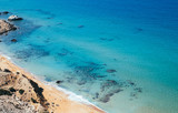 Fototapeta Niebo - The red beach (red sand) at Matala, Crete, Greece.