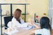© Nawarit - The doctor examines the patient's condition to treat the illness and pain in the wrist bone.