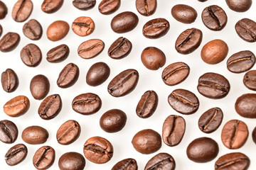 Wall Mural - coffee beans isolated on white background, full frame close up image of coffee beans