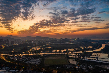 Wall Mural - Aerial View of rural green fields in Hong Kong border and skylines in Shenzhen,China