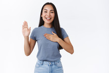 Optimistic, Honest And Cute Asian Girl Give Oath, Swear Tell Truth, Put Hand On Heart And Raise One Arm As Making Promise, Express Devotion And Declare Telling Only Truth, Stand White Background