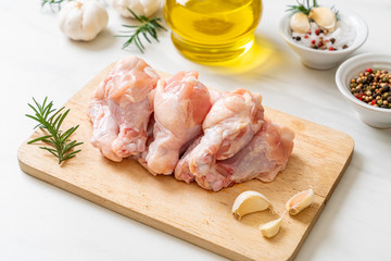 Canvas Print - fresh raw chicken wings (drumette or drumstick) on wooden board