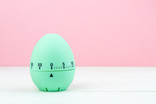 Blue Kitchen Egg Timer On A Pink Background. Cooking Time, Soon Easter