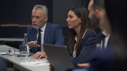 Wall Mural - The business people discuss something at the business conference