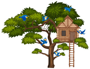 Big green tree and many blue birds flying over the treehouse
