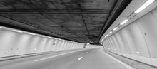 Empty Road In Illuminated Tunnel