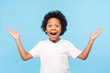 © khosrork - No way, I can't believe! Portrait of funny amazed preschool boy keeping hands up in astonishment, looking surprised and sarcastic at camera, excited shocked by sudden news. studio shot blue background