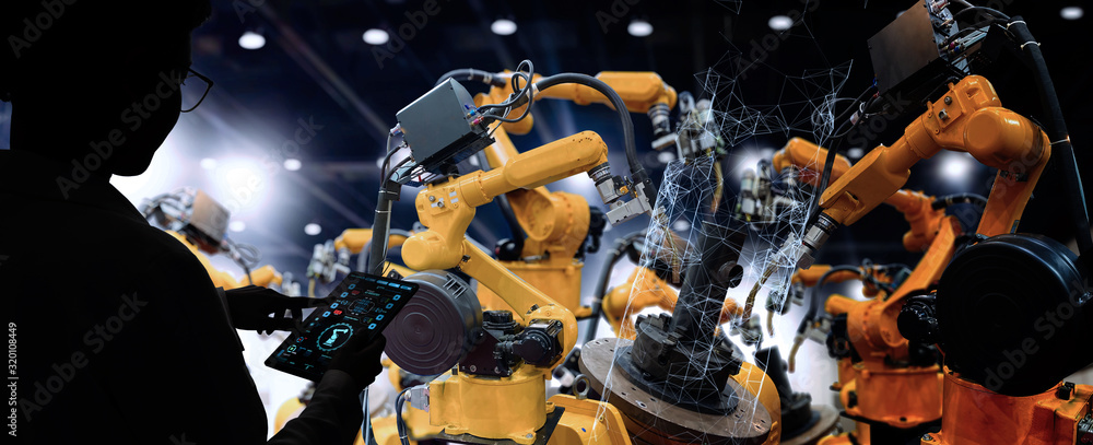 Factory Female Industrial Engineer working with automation robot arms machine in intelligent factory industrial on real time monitoring system software.Digital future manufacture. - obrazy, fototapety, plakaty 