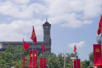 red state flags on a square in vietnam