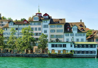 Poster - Historical Buildings at Limmat River Quay in Zurich, Switzerland. People on the background