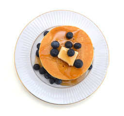 Wall Mural - Stack of pancakes with fresh blueberry on white